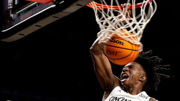 Cincinnati Bearcats guard-forward Rayvon Griffith (3) dunks in the second half of a basketball scrimmage between Cincinnati Bearcats and Ohio State Buckeyes at Fifth Third Arena in Cincinnati on Friday, Oct. 18, 2024.