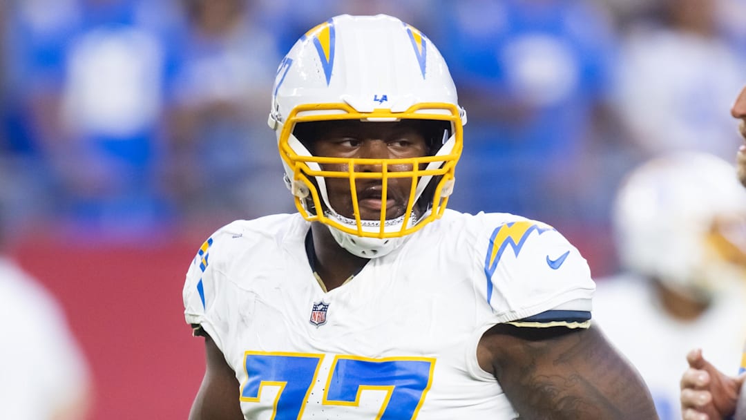 Oct 21, 2024; Glendale, Arizona, USA; Los Angeles Chargers guard Zion Johnson (77) against the Arizona Cardinals at State Farm Stadium. Mandatory Credit: Mark J. Rebilas-Imagn Images