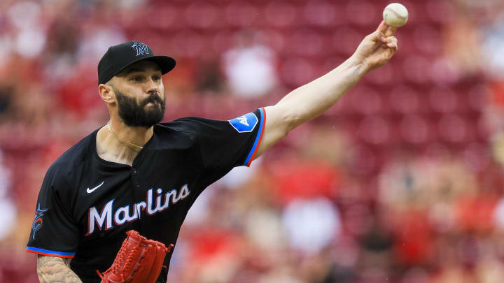 Jul 14, 2024; Cincinnati, Ohio, USA; Miami Marlins relief pitcher Tanner Scott (66) pitches against the Cincinnati Reds in the ninth inning at Great American Ball Park.