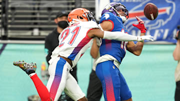 AFC cornerback Denzel Ward of the Cleveland Browns (21) breaks up a pass intended for NFC wide receiver Justin Jefferson of the Minnesota Vikings (18) during the Pro Bowl football game at Allegiant Stadium.