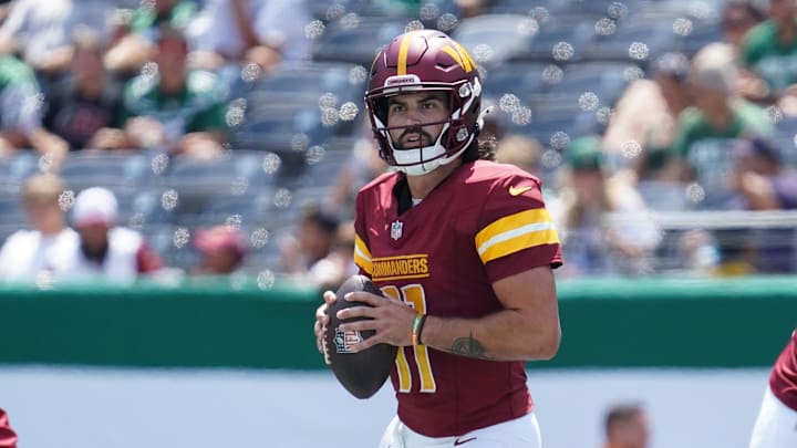 Aug 10, 2024; East Rutherford, New Jersey, USA; Washington Commanders quarterback Sam Hartman (11) surveys the field during the third quarter against the New York Jets at MetLife Stadium. Mandatory Credit: Lucas Boland-Imagn Images