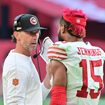 Jan 5, 2025; Glendale, Arizona, USA; San Francisco 49ers wide receiver Jauan Jennings (15) talks with head coach Kyle Shanahan after being ejected in the first half against the Arizona Cardinals at State Farm Stadium. Mandatory Credit: Matt Kartozian-Imagn Images