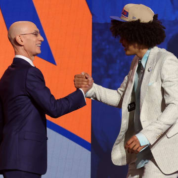 Jun 26, 2024; Brooklyn, NY, USA; Kyshawn George shakes hands with NBA commissioner Adam Silver after being selected in the first round by the New York Knicks in the 2024 NBA Draft at Barclays Center. Mandatory Credit: Brad Penner-USA TODAY Sports
