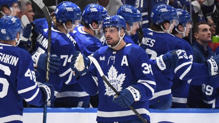 Apr 11, 2024; Toronto, Ontario, CAN; Toronto Maple Leafs forward Auston Matthews (34) celebrates with team mates at the bench after scoring a goal against the New Jersey Devils in the second period at Scotiabank Arena. Mandatory Credit: Dan Hamilton-USA TODAY Sports