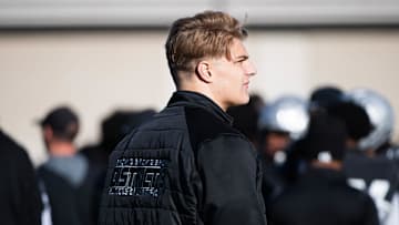Injured Harrisburg lineman and Penn State commit Kevin Brown walks the sideline in the first half of a District 3 Class 6A quarterfinal game against Dallastown, Saturday, Nov. 9, 2024, at Severance Field in Harrisburg.
