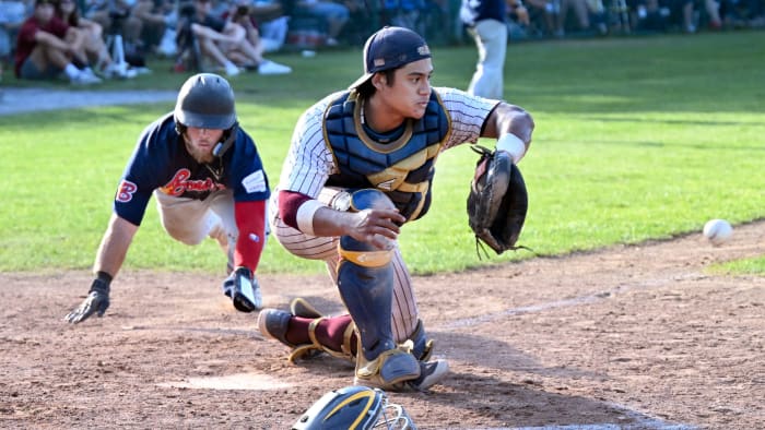 Catcher Calen Lomavita attempts to make a tag during Cape Cod Baseball League action