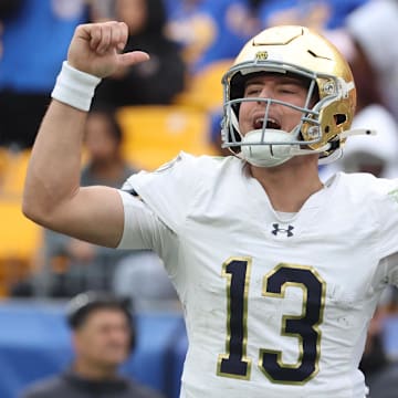 Nov 15, 2025; Pittsburgh, Pennsylvania, USA;  Notre Dame Fighting Irish quarterback CJ Carr (13) calls an audible at the line of scrimmage against the Pittsburgh Panthers during the fourth quarter at Acrisure Stadium. Mandatory Credit: Charles LeClaire-Imagn Images
