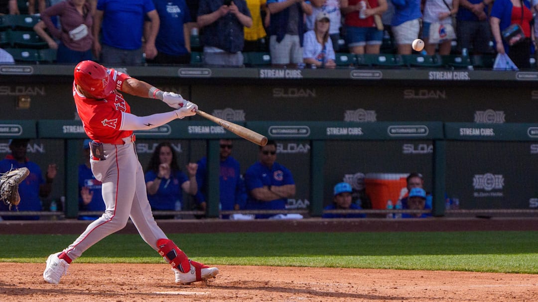 Feb 27, 2025; Mesa, Arizona, USA; Los Angeles Angels infielder Kyren Paris (19) hits a home run in the top of the ninth with two outs during a spring training game against the Chicago Cubs at Sloan Park to tie the game 4-4. Mandatory Credit: Allan Henry-Imagn Images