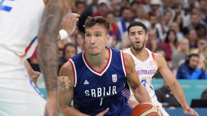 Jul 31, 2024; Villeneuve-d'Ascq, France; Serbia shooting guard Bogdan Bogdanovic (7) dribbles in the first quarter against Puerto Rico during the Paris 2024 Olympic Summer Games at Stade Pierre-Mauroy. Mandatory Credit: John David Mercer-USA TODAY Sports