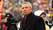 Former head coach Urban Meyer watches from the sideline during the NCAA football game between the Michigan Wolverines and the Ohio State Buckeyes at Michigan Stadium in Ann Arbor.