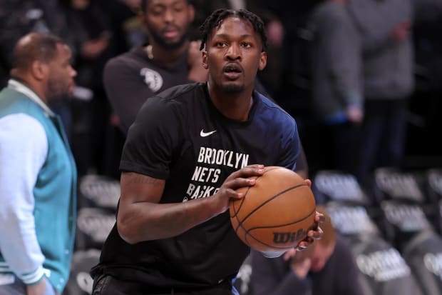 Dorian Finney-Smith warms up before a game.