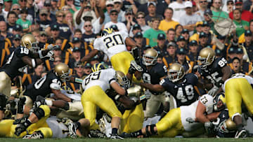 Michael Hart hurdle the Notre Dame defense for a touchdown.