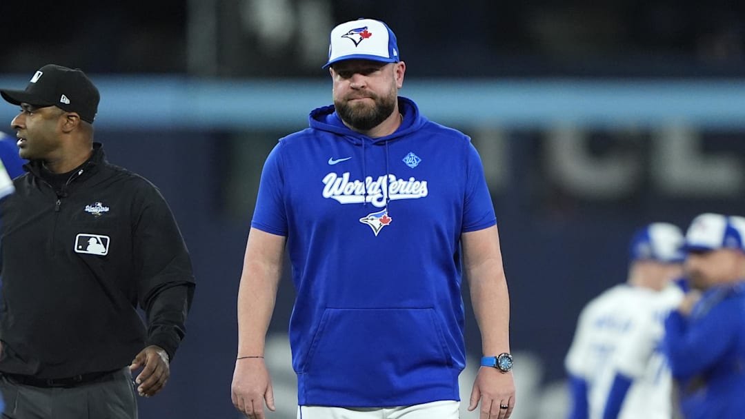 Blue Jays manager John Schneider (14) reacts after the benches clear in the fourth inning against the Los Angeles Dodgers during game seven of the 2025 MLB World Series at Rogers Centre. Blue Jays manager John Schneider (14) reacts after the benches clear in the fourth inning against the Los Angeles Dodgers during game seven of the 2025 MLB World Series at Rogers Centre.