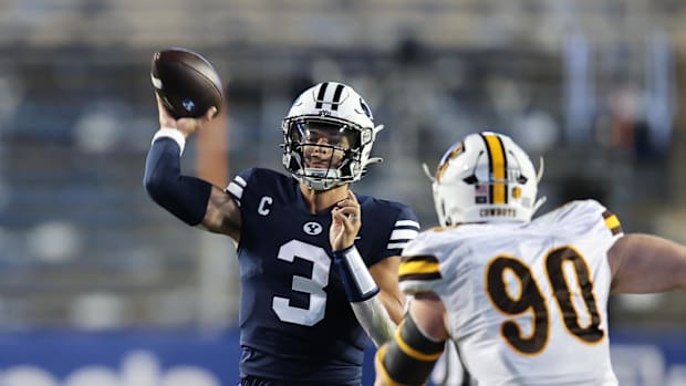  Brigham Young Cougars quarterback Jaren Hall (3) passes the ball against Wyoming Cowboys nose tackle Gavin Meyer (90).