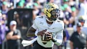 3Sep 27, 2025; Manhattan, Kansas, USA; UCF Knights quarterback Jacurri Brown (11) drops back to pass during the second quarter against the Kansas State Wildcats at Bill Snyder Family Football Stadium. Mandatory Credit: Scott Sewell-Imagn Images