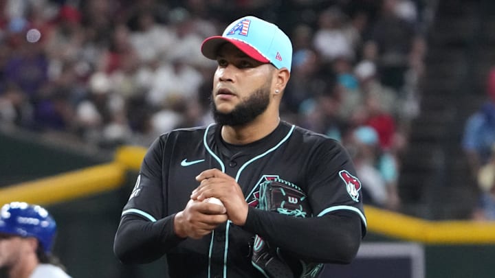 Jul 4, 2025; Phoenix, Arizona, USA; Arizona Diamondbacks pitcher Eduardo Rodriguez (57) reacts after allowing a three run home run to Kansas City Royals first base Vinnie Pasquantino (9) during the first inning at Chase Field. Mandatory Credit: Joe Camporeale-Imagn Images