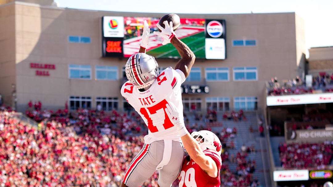 Ohio State Buckeyes wide receiver Carnell Tate (17) catches a touchdown pass against Wisconsin Badgers safety Matt Jung (29) in the first half at Camp Randall Stadium on Saturday, Oct. 18, 2025 in Madison, Wisconsin.