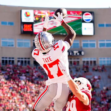 Ohio State Buckeyes wide receiver Carnell Tate (17) catches a touchdown pass against Wisconsin Badgers safety Matt Jung (29) in the first half at Camp Randall Stadium on Saturday, Oct. 18, 2025 in Madison, Wisconsin.