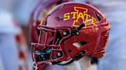 Nov 9, 2024; Kansas City, Missouri, USA; Iowa State Cyclones helmets on the bench during the first quarter against the Kansas Jayhawks at GEHA Field at Arrowhead Stadium. Mandatory Credit: William Purnell-Imagn Images