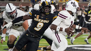 Missouri Tigers defensive end Zion Young (9) attempts a sack, in a game against the Mississippi State Bulldogs this season.