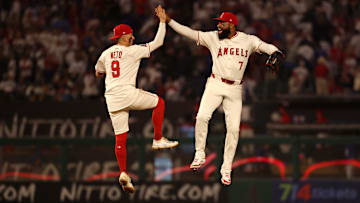 Anaheim, California, USA;  Los Angeles Angels shortstop Zach Neto (9) and right fielder Jo Adell (7) celebrate a win after defeating the Los Angeles Dodgers 6-5 at Angel Stadium.