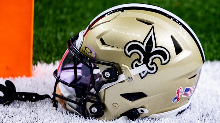Sep 8, 2024; New Orleans, Louisiana, USA; Detailed view of the New Orleans Saints football helmet before the game against the Carolina Panthers during the pregame at Caesars Superdome. Mandatory Credit: Stephen Lew-Imagn Images Sep 8, 2024; New Orleans, Louisiana, USA; Detailed view of the New Orleans Saints football helmet before the game against the Carolina Panthers during the pregame at Caesars Superdome. Mandatory Credit: Stephen Lew-Imagn Images