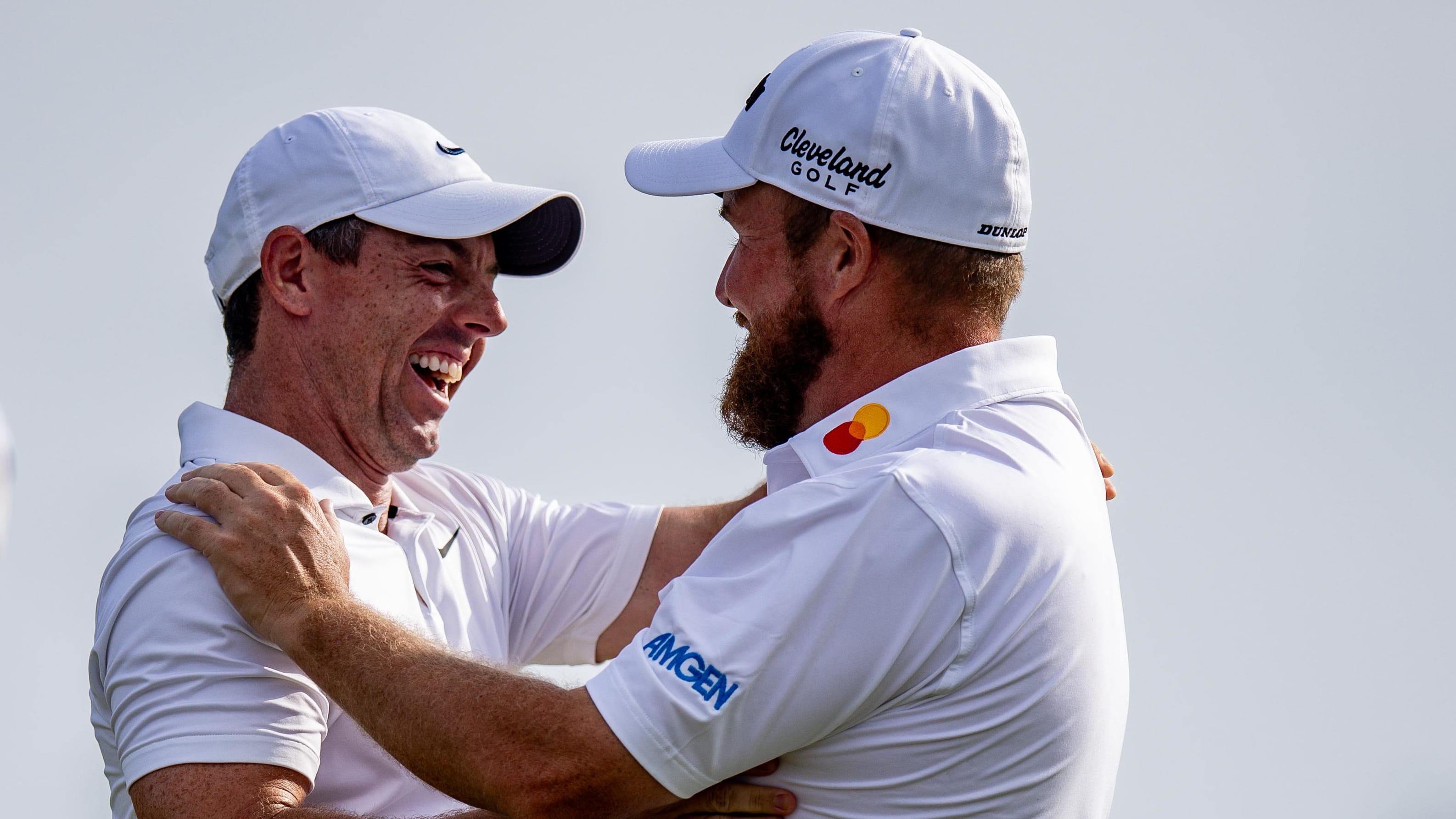 Shane Lowry hugs Rory McIlroy after winning the 2024 Zurich Classic.