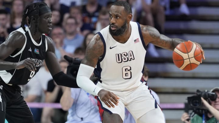 Jul 31, 2024; Villeneuve-d'Ascq, France; United States guard Lebron James (6) dribbles against South Sudan power forward Wenyen Gabriel (9) in the second quarter during the Paris 2024 Olympic Summer Games at Stade Pierre-Mauroy. Mandatory Credit: John David Mercer-USA TODAY Sports