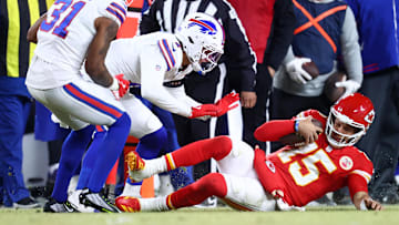 Jan 26, 2025; Kansas City, MO, USA; Kansas City Chiefs quarterback Patrick Mahomes (15) slides for a first down against the Buffalo Bills during the first half in the AFC Championship game at GEHA Field at Arrowhead Stadium. Mandatory Credit: Mark J. Rebilas-Imagn Images