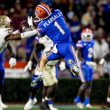 Florida Gators wide receiver Ricky Pearsall (1) makes a catch over Florida State Seminoles defensive