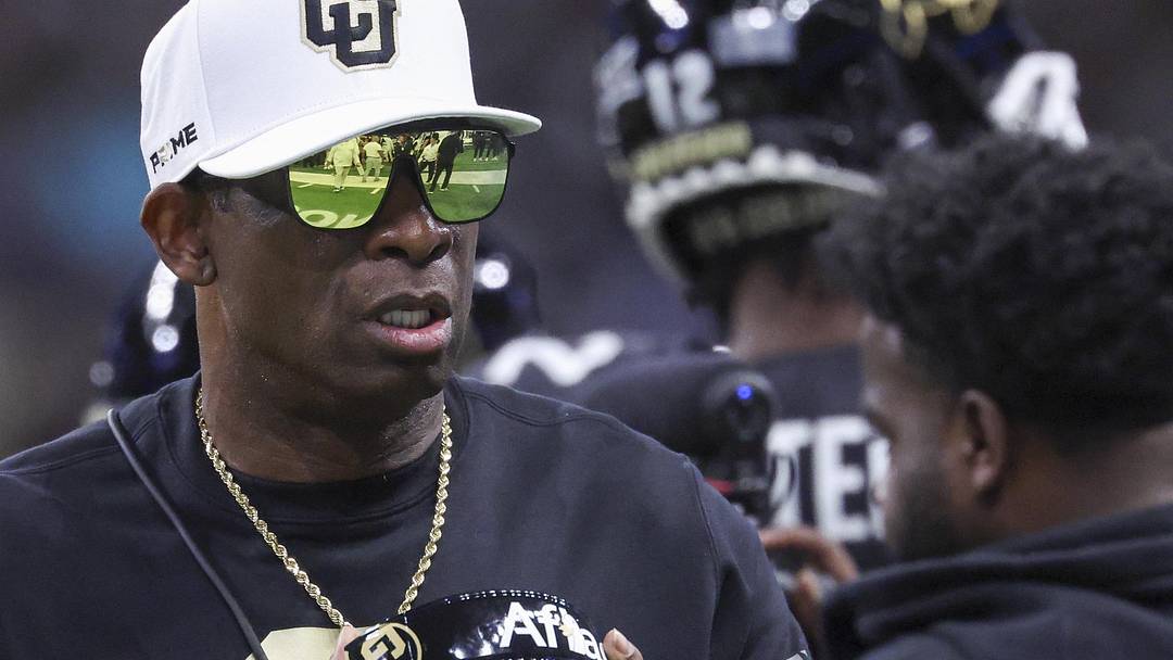 Dec 28, 2024; San Antonio, TX, USA; Colorado Buffaloes head coach Deion Sanders walks on the field between plays during the first quarter against the Brigham Young Cougars at Alamodome. 