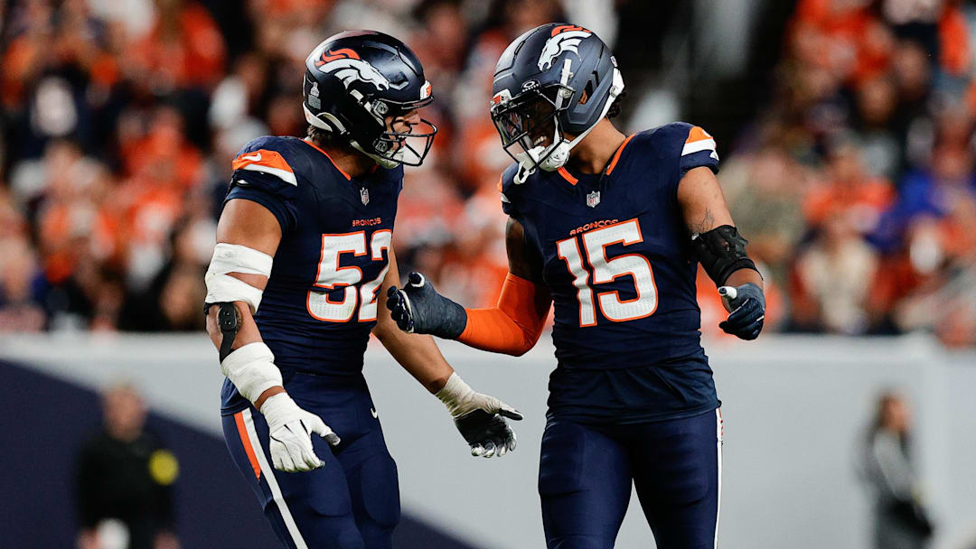 Sep 29, 2025; Denver, Colorado, USA; Denver Broncos linebacker Nik Bonitto (15) celebrates with Denver Broncos linebacker Jonah Elliss (52) after sacking Cincinnati Bengals quarterback Jake Browning (6) (not pictured) during the third quarter at Empower Field at Mile High. 