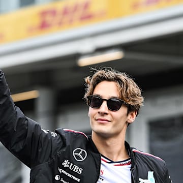 Jun 9, 2024; Montreal, Quebec, CAN; Mercedes driver George Russell (GBR) salutes the crowd during the drivers parade of the Canadien Grand Prix at Circuit Gilles Villeneuve. Mandatory Credit: David Kirouac-Imagn Images