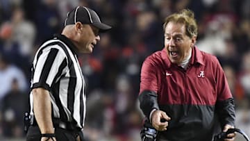 Nov 25, 2023; Auburn, Alabama, USA;  Alabama Crimson Tide head coach Nick Saban protests a call by the officials against Alabama during a game against the Auburn Tigers at Jordan-Hare Stadium. Alabama won 27-24. Mandatory Credit: Gary Cosby Jr.-Imagn Images