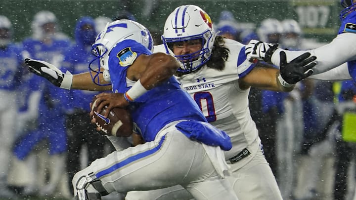 Oct 28, 2023; Fort Collins, Colorado, USA;  Colorado State Rams defensive lineman Grady Kelly (90) chases Air Force Falcons quarterback Zac Larrier (9) in the second quarter at Sonny Lubick Field at Canvas Stadium. Mandatory Credit: Michael Madrid-Imagn Images