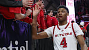 Mar 9, 2025; Piscataway, New Jersey, USA; Rutgers Scarlet Knights guard Ace Bailey (4) slap hands with fans after the game against the Minnesota Golden Gophers at Jersey Mike's Arena. Mandatory Credit: Vincent Carchietta-Imagn Images