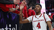 Mar 9, 2025; Piscataway, New Jersey, USA; Rutgers Scarlet Knights guard Ace Bailey (4) slap hands with fans after the game against the Minnesota Golden Gophers at Jersey Mike's Arena. Mandatory Credit: Vincent Carchietta-Imagn Images