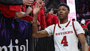 Mar 9, 2025; Piscataway, New Jersey, USA; Rutgers Scarlet Knights guard Ace Bailey (4) slap hands with fans after the game against the Minnesota Golden Gophers at Jersey Mike's Arena. Mandatory Credit: Vincent Carchietta-Imagn Images