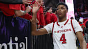 Mar 9, 2025; Piscataway, New Jersey, USA; Rutgers Scarlet Knights guard Ace Bailey (4) slap hands with fans after the game against the Minnesota Golden Gophers at Jersey Mike's Arena. Mandatory Credit: Vincent Carchietta-Imagn Images