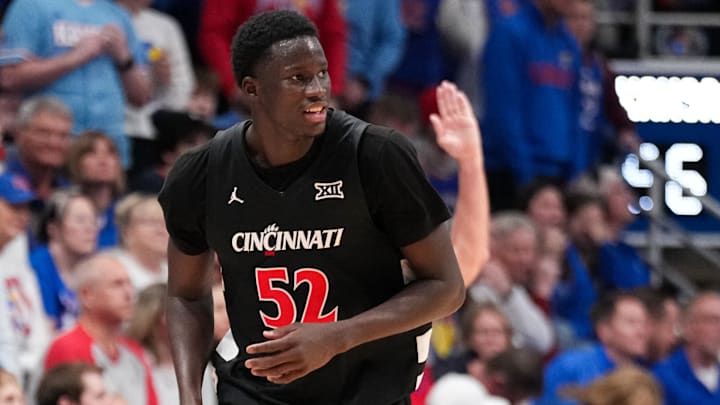Feb 21, 2026; Lawrence, Kansas, USA; Cincinnati Bearcats center Moustapha Thiam (52) celebrates after scoring against the Kansas Jayhawks during the second half of the game at Allen Fieldhouse. Mandatory Credit: Denny Medley-Imagn Images