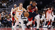 Nov 25, 2025; Washington, District of Columbia, USA; Washington Wizards center Alex Sarr (20) steals the ball from Atlanta Hawks guard Luke Kennard (3) in the second half at Capital One Arena. Mandatory Credit: Geoff Burke-Imagn Images