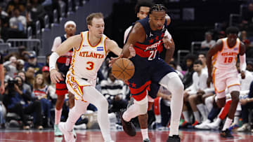 Nov 25, 2025; Washington, District of Columbia, USA; Washington Wizards center Alex Sarr (20) steals the ball from Atlanta Hawks guard Luke Kennard (3) in the second half at Capital One Arena. Mandatory Credit: Geoff Burke-Imagn Images