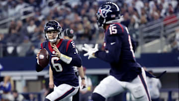 Dec 11, 2022; Arlington, Texas, USA;  Houston Texans quarterback Jeff Driskel (6) looks to throw to Houston Texans wide receiver Chris Moore (15) during the first quarter against the Dallas Cowboys at AT&T Stadium.