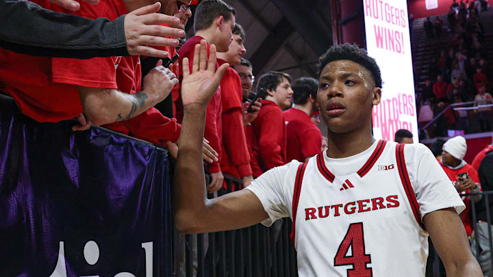 Mar 9, 2025; Piscataway, New Jersey, USA; Rutgers Scarlet Knights guard Ace Bailey (4) slap hands with fans after the game against the Minnesota Golden Gophers at Jersey Mike's Arena. Mandatory Credit: Vincent Carchietta-Imagn Images