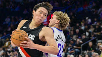 Oct 16, 2025; Salt Lake City, Utah, USA: Utah Jazz forward/center Lauri Markkanen (23) guards Portland Trail Blazers center Yang Hansen (16) during the first half at Delta Center. Mandatory Credit: Peter Creveling-Imagn Images