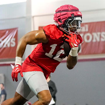Ohio State Buckeyes running back C.J. Donaldson (12) carries the ball during spring football practice at the Woody Hayes Athletic Center in Columbus on March 19, 2025.