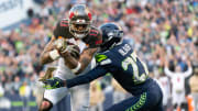 Nov 3, 2019; Seattle, WA, USA; Tampa Bay Buccaneers wide receiver Mike Evans (13) fights for yards while being tackled by Seattle Seahawks defensive back Marquise Blair (27) during the second half at CenturyLink Field. Seattle defeated Tampa Bay 40-34. Mandatory Credit: Steven Bisig-USA TODAY Sports