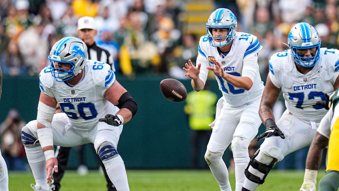 Detroit Lions quarterback Jared Goff (16) calls for a snap from guard Graham Glasgow (60) against Green Bay Packers during the second half at Lambeau Field in Green Bay, Wis., on Sunday, September 7, 2025.