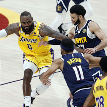 Los Angeles Lakers forward LeBron James (6) against Denver Nuggets guards Jamal Murray (27) and Bruce Brown (11) in the Western Conference Finals at Ball Arena. 