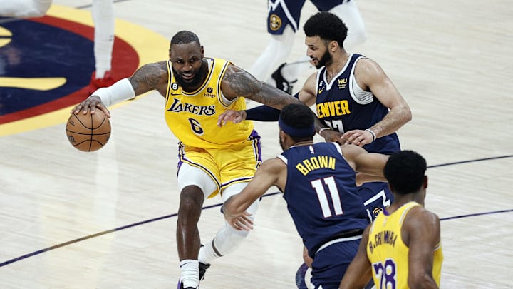 Los Angeles Lakers forward LeBron James (6) against Denver Nuggets guards Jamal Murray (27) and Bruce Brown (11) in the Western Conference Finals at Ball Arena. 